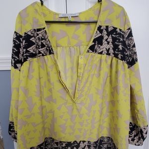 Collective Concepts tunic in black and yellow prin